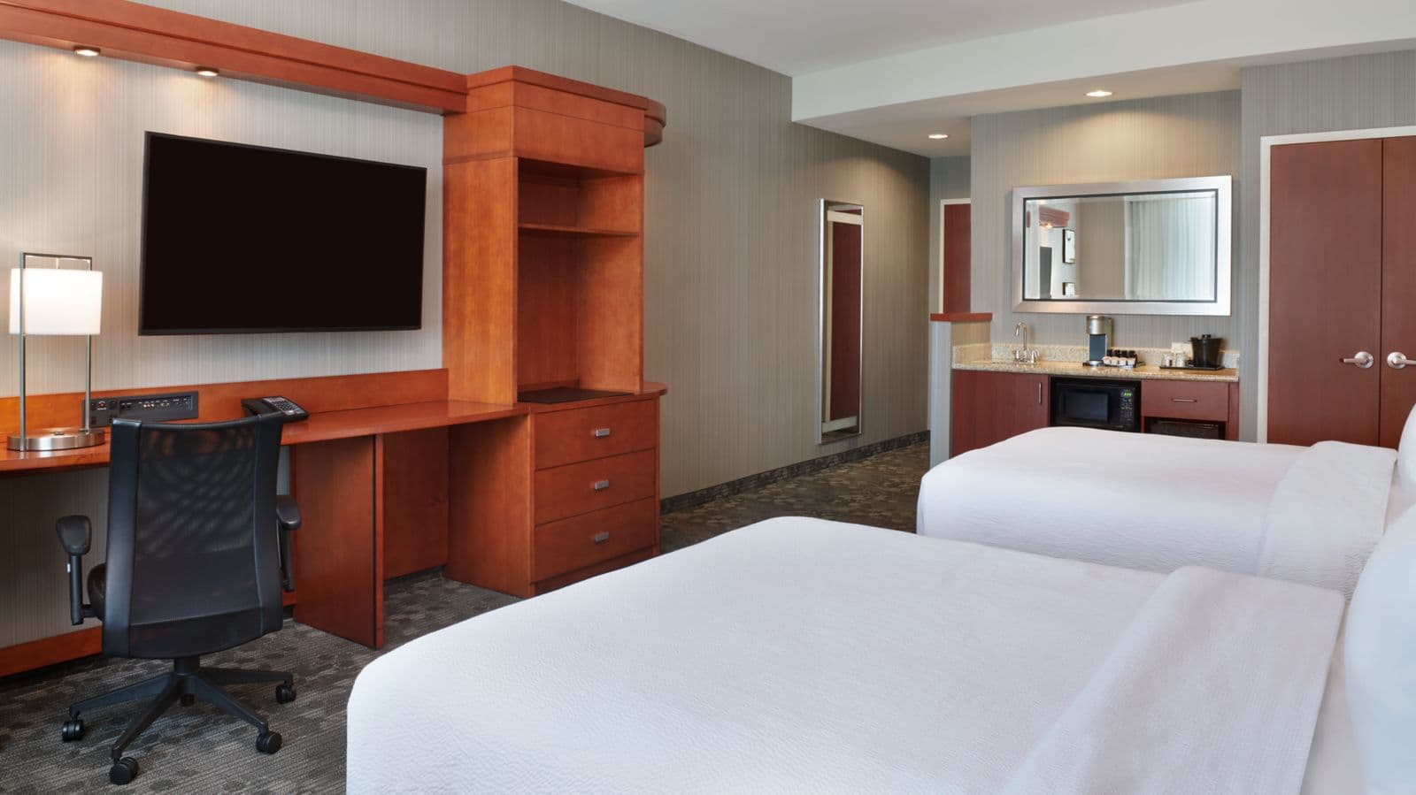 A Double Queen guest room at Courtyard by Marriott Ottawa East